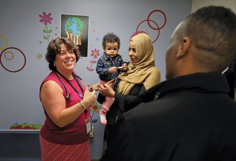 Dr. Lisa DiBrigida, with young patient Fatmah and her parents. (Photo by Cheryl Senter.)