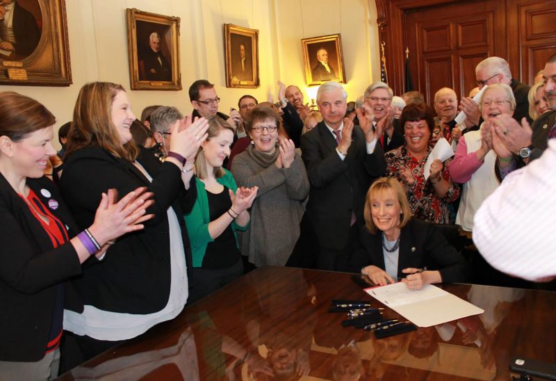 Then-Governor Maggie Hassan signs the bill reauthorizing the expansion of the state’s Medicaid program, which provided nearly 50,000 Granite Staters access to health care, including care for addiction services. (Photo courtesy of New Futures.)